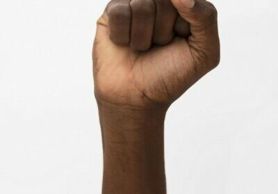 black-person-holding-their-fist-up