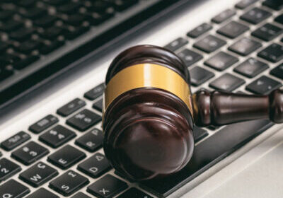 Online auction concept. Auction or judge gavel on a computer keyboard