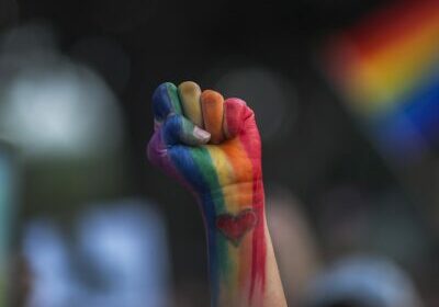 LOS ANGELES, CA - JUNE 13: A defiant fist is raised at a vigil for the worst mass shooing in United States history on June 13, 2016 in Los Angeles, United States. A gunman killed 49 people and wounded 53 others at a gay nightclub in Orlando, Florida early yesterday morning before suspect Omar Mateen also died on-scene.  (Photo by David McNew/Getty Images)