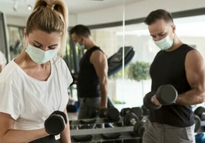 man-and-woman-working-out-together-at-the-gym