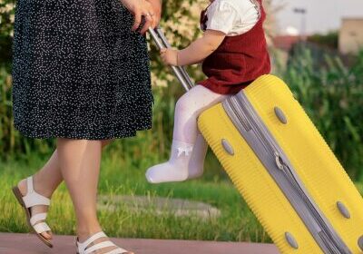 travel-concept-mom-daughter-with-suitcase-are-preparing-trip-child-sits-suitcase
